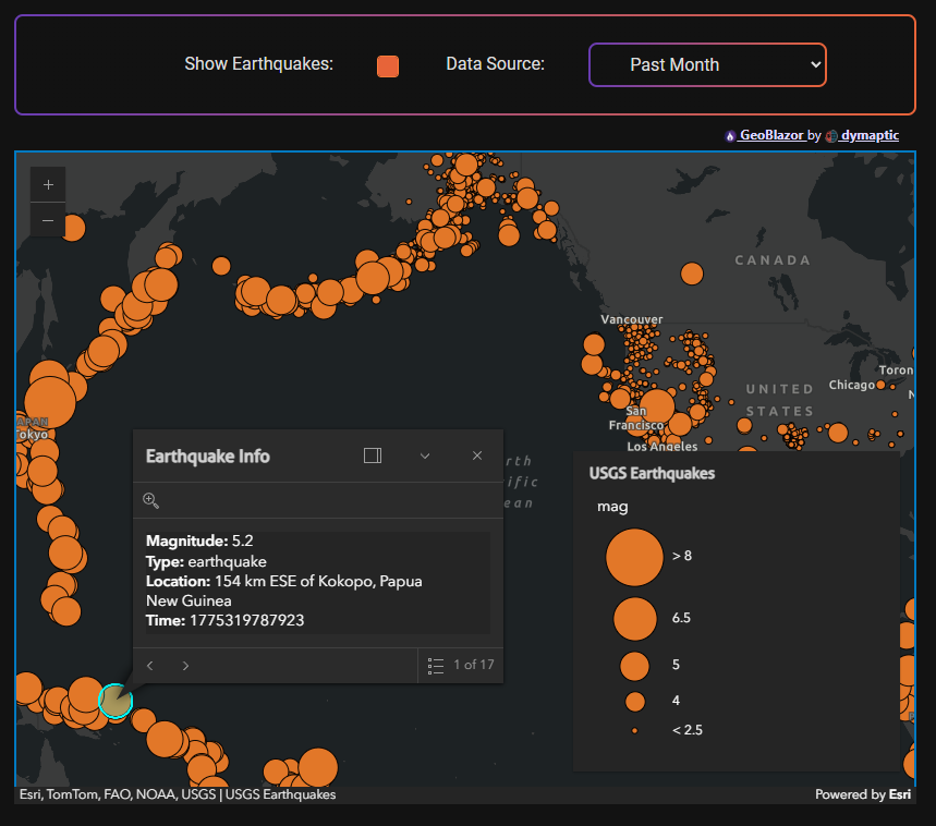 Completed GeoBlazor sample showing the Show Earthquakes checkbox enabled and Past Month data source selected, with a dark-gray world map covered in orange earthquake markers across the Pacific Rim, an open Earthquake Info popup displaying magnitude 5.2 details for an event near Kokopo, Papua New Guinea, and the USGS Earthquakes legend showing proportional symbols from less than 2.5 to greater than 8.